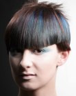 Short geometric cut for brown hair with blue streaks