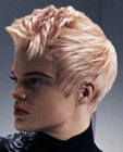 Short blonde hair with a dynamic shape and pink accents