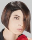 Short precision cut bob with sleek styling