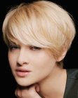 Sporty low maintenance pixie cut with long side bangs