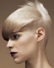 Very short blonde hair with buzzed sides and back