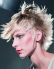 Feathery wild blonde hair with exaggerated sideburns