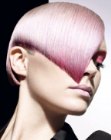 Blonde wedge shape hair with a pink sheen