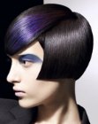 Cheekbone length bob for dark hair with a blue color accent