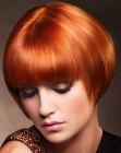 Red hair cut into a very short bob with bangs