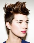 Short haircut with buzzed sides and longer hair on the crown for women