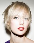 Short feathery hairstyle with layered sides and sleek bangs