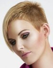 Very short hairstyle with buzzed sides for women