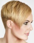 Short women's hairstyle with a shaved nape and sides