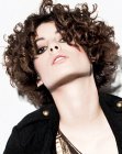 Trendy short hairstyle with layers and corkscrew curls