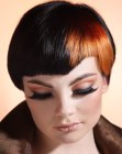 Short cap-style haircut with a cut out corner in the bangs