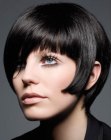 Short black hair with roundness and a snug fitting neckline