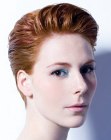 Short red hair with root lift and backward styling