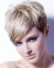 Short hairstyle with layers, diagonal bangs and blonde hues
