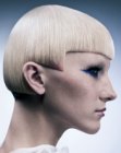 Short blonde hair with sharp angles and very short bangs