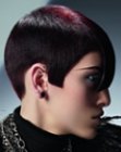Short geometric haircut with a curve around the ear