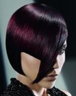 Futuristic asymmetrical chin length bob for purple hair