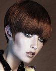 Short haircut with pointed sides and low bangs