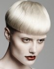 Blonde mushroom cut with a blunt horizontal line