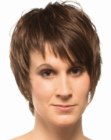 Pixie cut with longer cutting lines and diagonal bangs