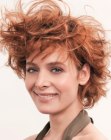 Short hairstyle with steep layering and deconstructed curls