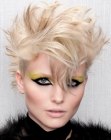 Short blonde hair with feathery styling and sharp pointed strands