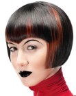 Sleek post punk bob with exact lines and curved bangs