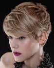 Blonde pixie cut with layering and side bangs