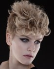 Blonde pixie cut with straight sides and curls in the crown