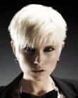 Platinum blond pixie haircut with razor-cut texture