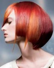 Bob haircut with elongated tendrils and warm hair colors