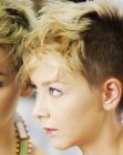 Very short haircut with buzz cut sides and back for women
