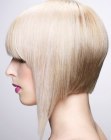 Blonde A-line bob with textured ends and bangs