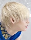 Short platinum blonde hair with a high pivot point