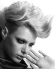 Short punk inspired hairstyle with shaved sides and wavy spikes