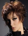 Posh short hairdo with textured bangs and sideburns