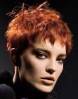 Short women's hairstyle with a graduated neck and a short fringe