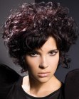 Short hairstyle with large curls and split bangs