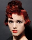 Red hair styled into a glamorous bob with waves