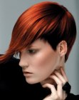 Red hair with a short graduated neck and a long fringe