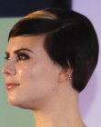 Short black hair with round curves and a blonde streak