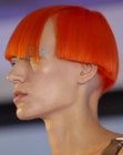 Orange hair cut short with a blunt line and a round shape