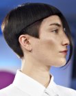 Short haircut with straight lines and triangular sideburns