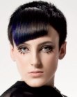Short brown hair with a blue color effect in the fringe