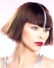 Blunt chin length bob with a platinum blonde streak