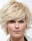 Ligth and feathery short hairstyle with lift at the roots