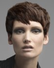 Brunette pixie cut with layers and jagged bangs