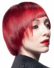 Ruby red hair cut into a short style with a long neck section