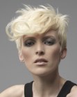 Blonde pixie with smooth sides and curly top hair