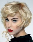 Flamboyant short textured bob with long tendrils